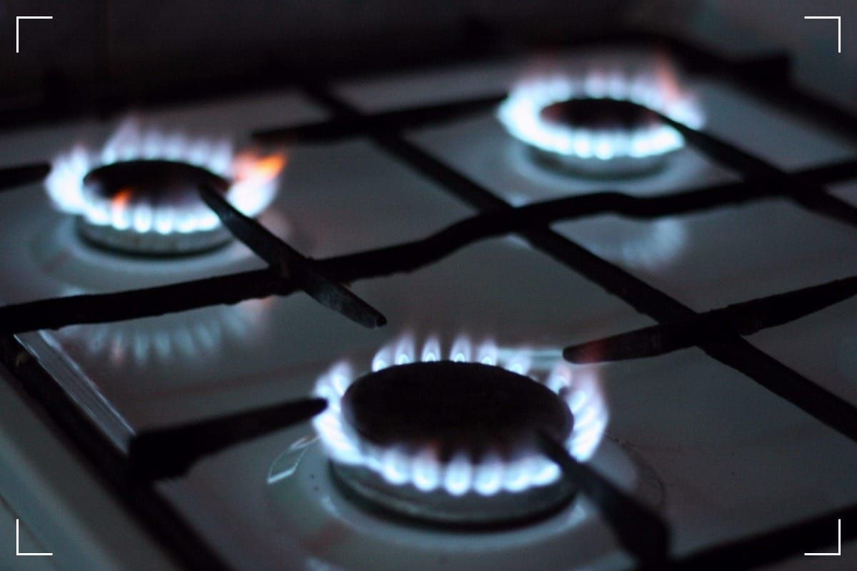 A gas stove burnign brightly.