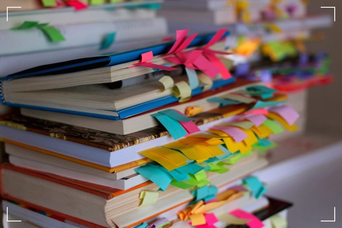 Books with pagemarkers sticking out. There are many.