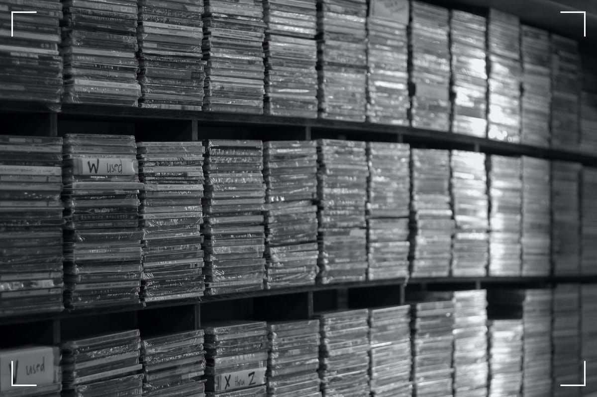 A stack of CDs in a rack.