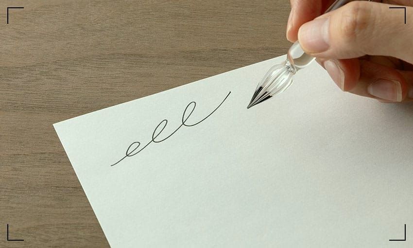 A white sheet of Japanese Midori paper and a glass pen.