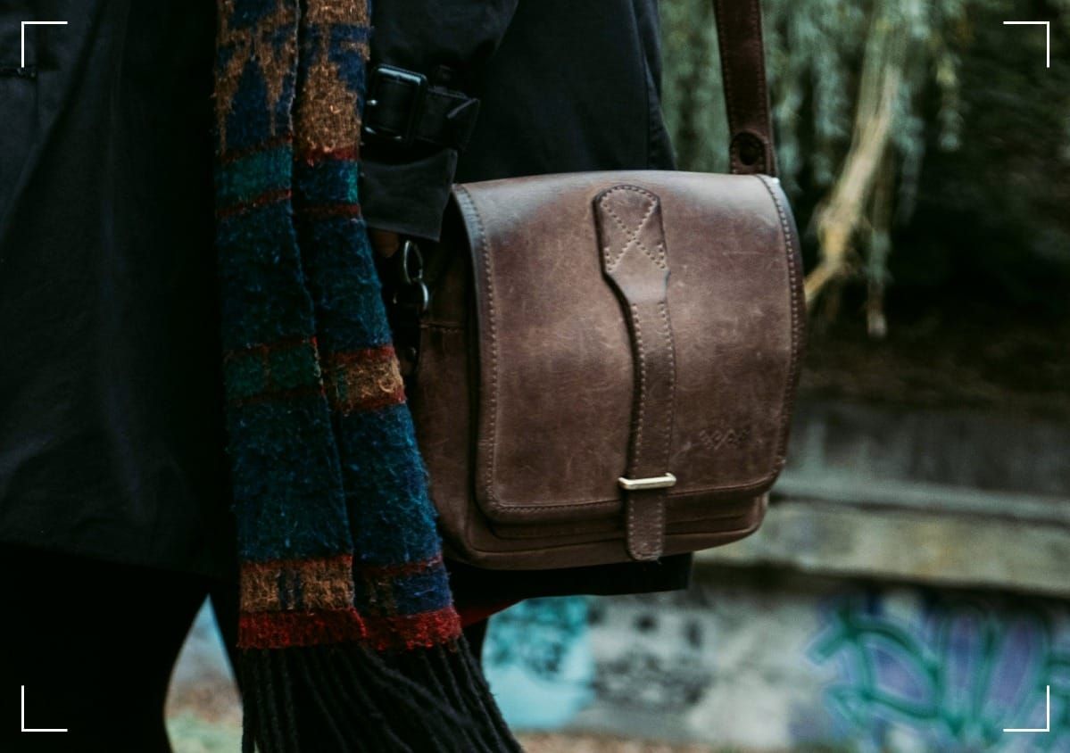 A brown leather cross-body bag.