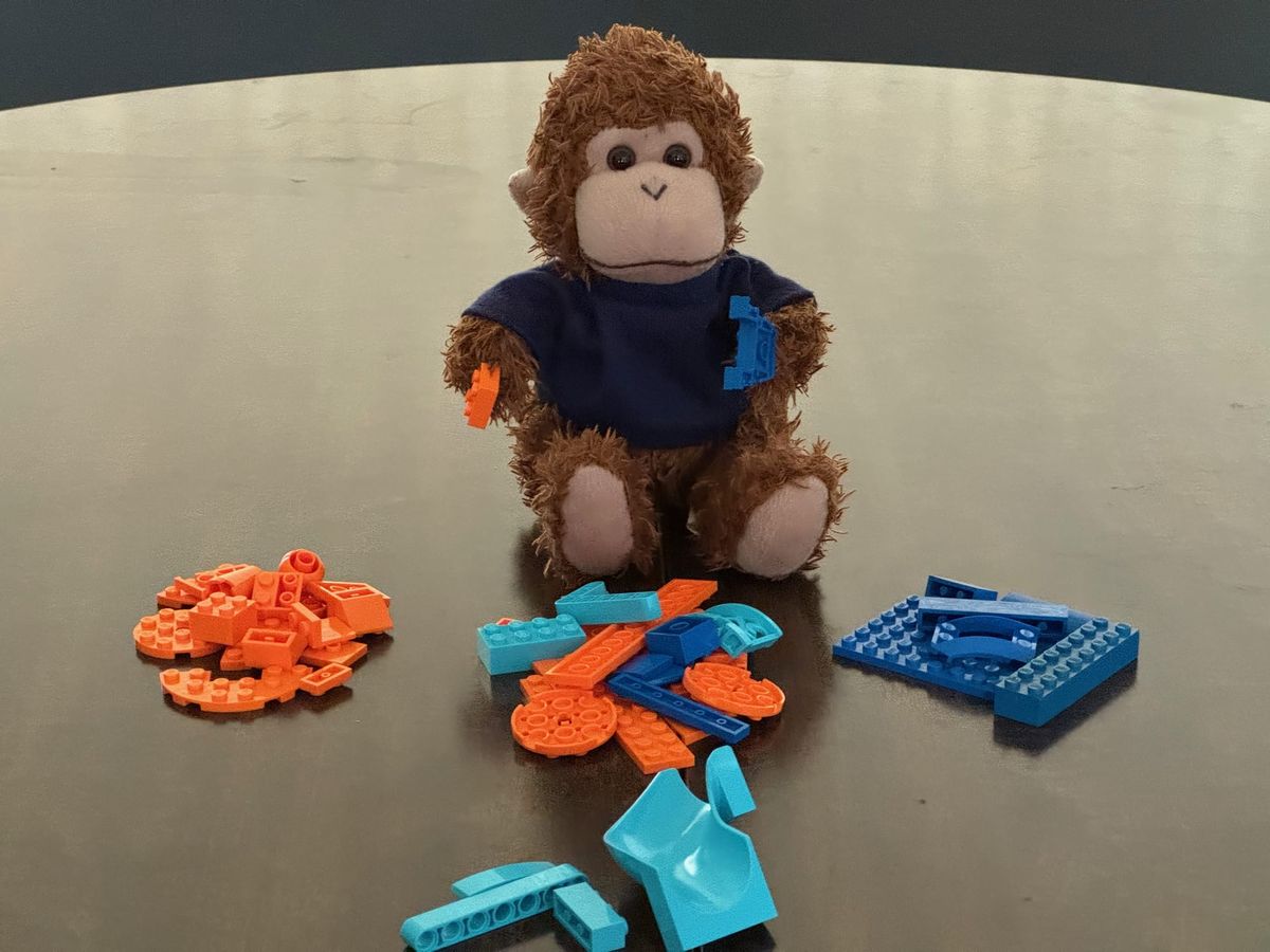 Bob T. Monkey sorting out different colored LEGO bricks.
