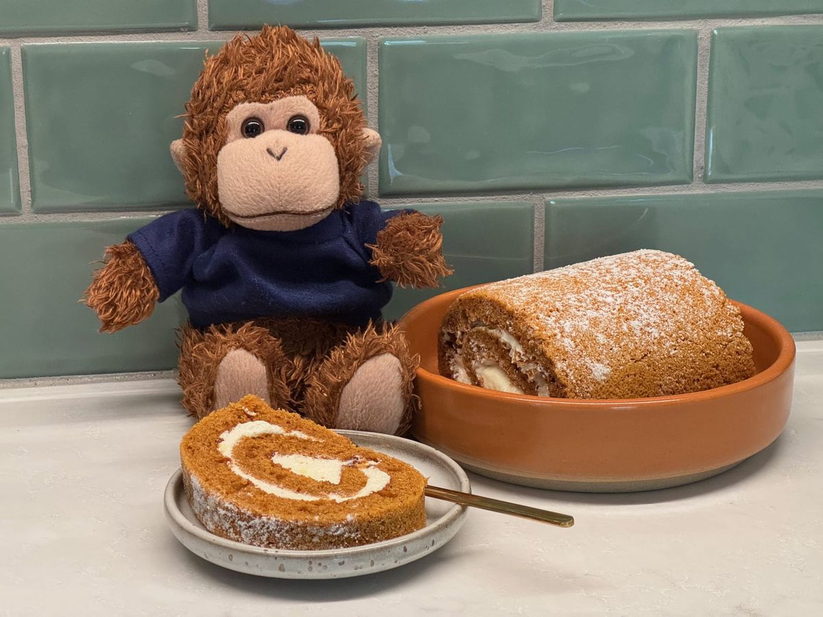 Bob T. Monkey celebrates with a slice of pumpkin roll.