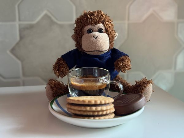 Bob enjoying an espresso and a treat.