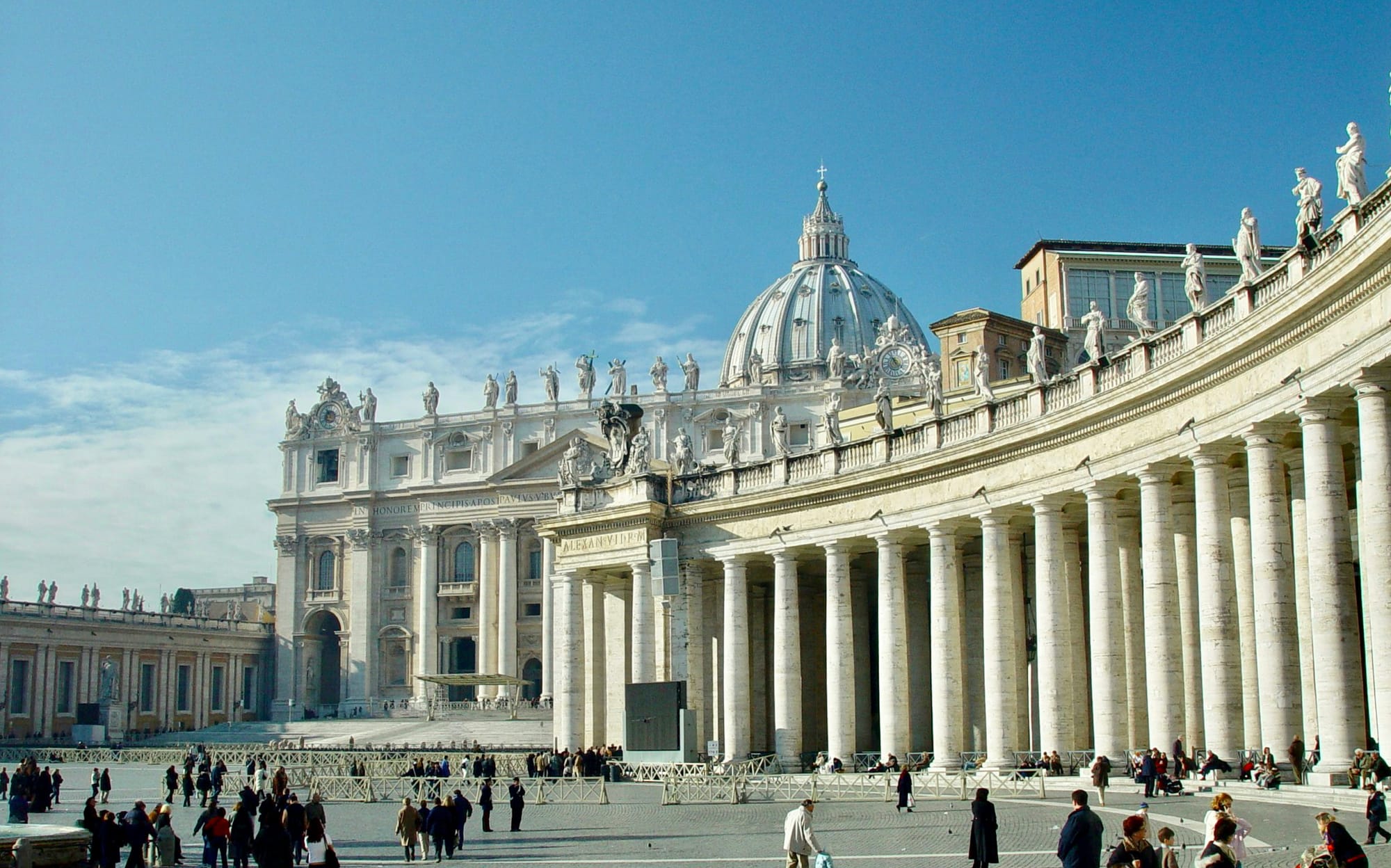 Low-angle view inside Saint Peter’s Basilica showing the dome springing from the four colossal piers above the high altar.