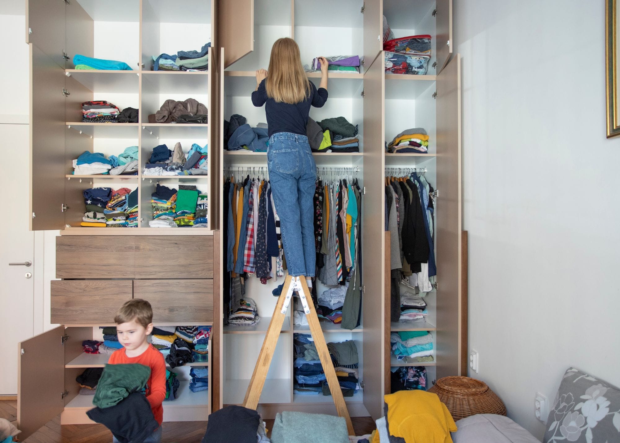 girl and a boy organising a wardrobe.jpg