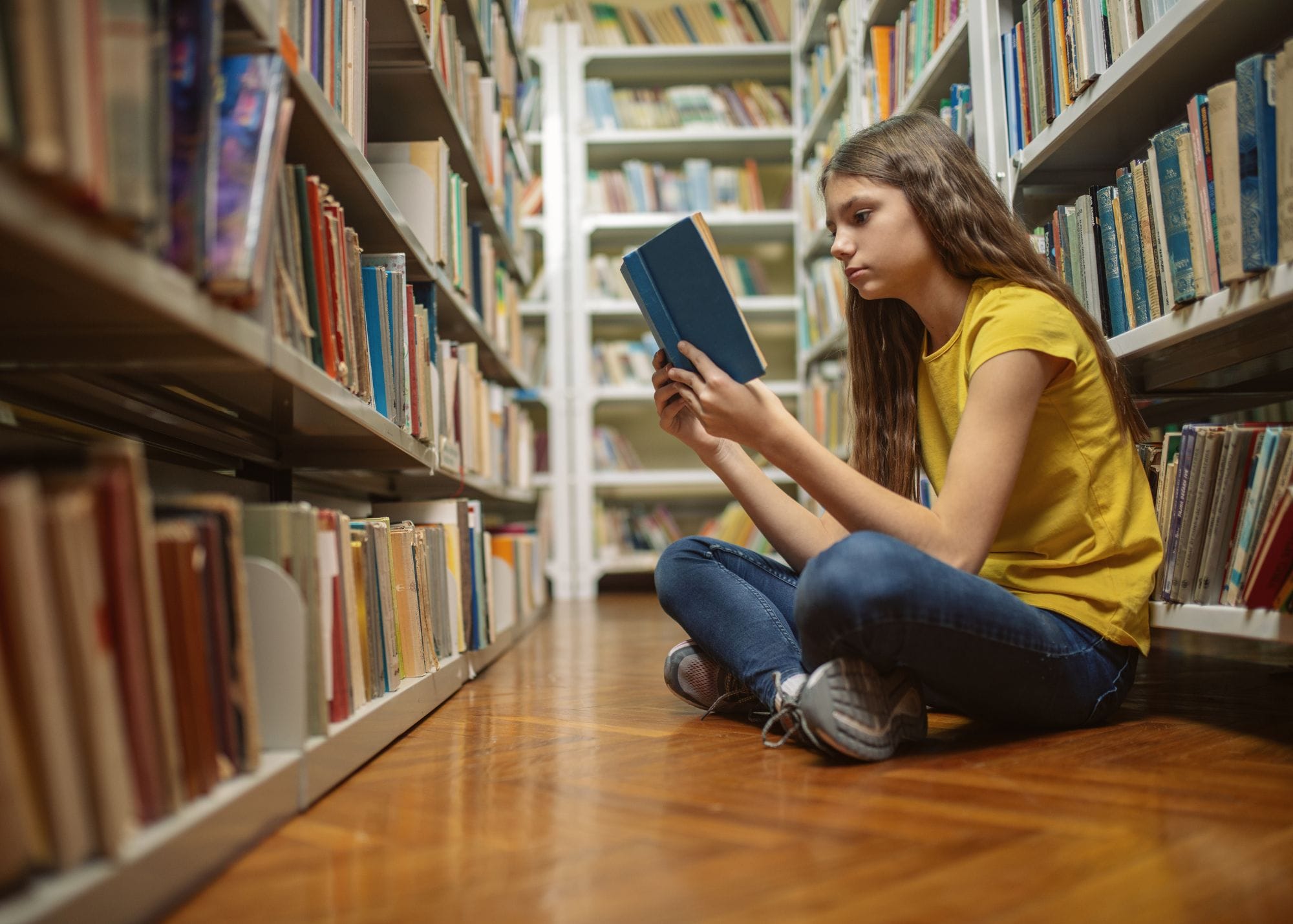 girl in library reading.jpg