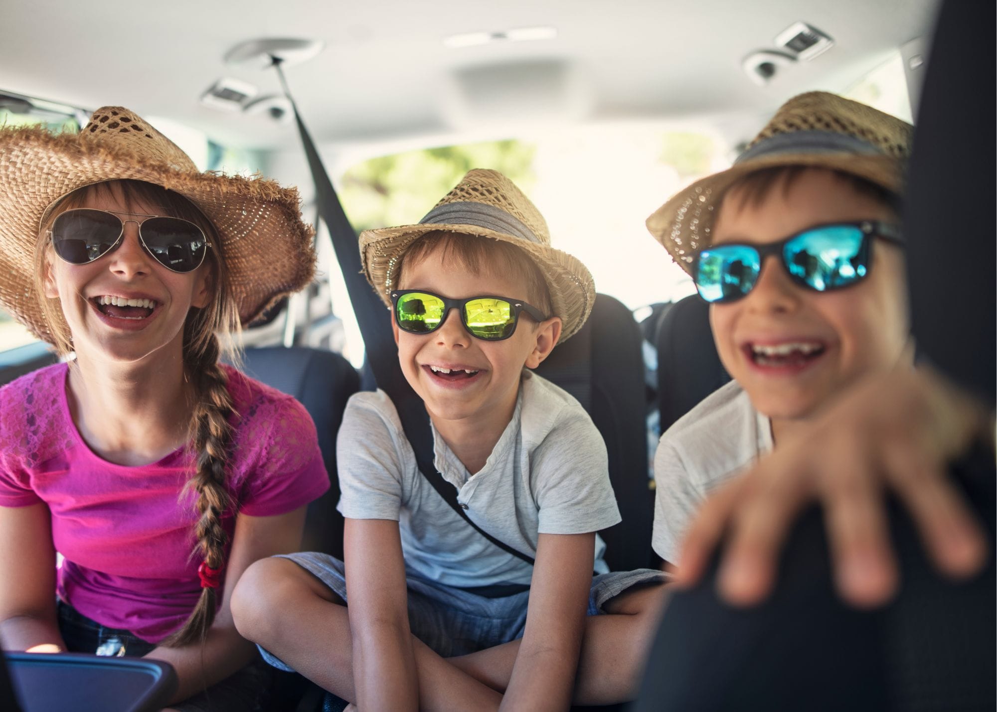three kids on roadtrip.jpg