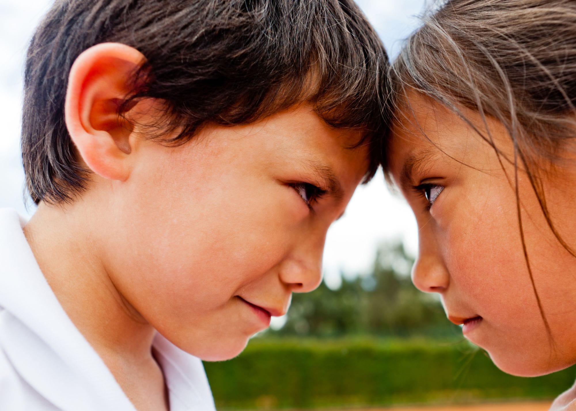 brother and sister looking upset with eachother.jpg