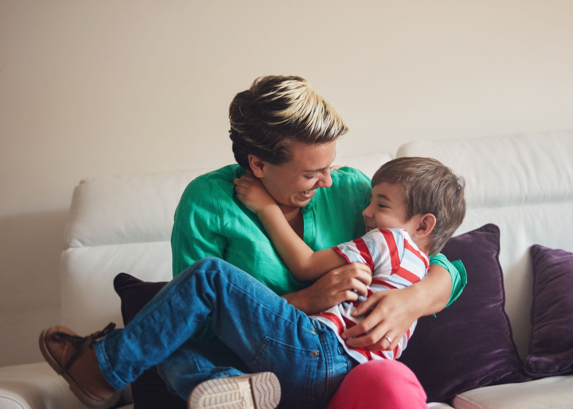mother tickling small child.jpg