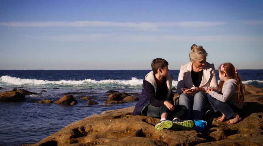 Bronte babysitter at beach with children