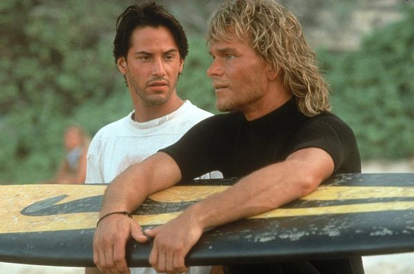 Keanu Reeves and Patrick Swayze on the beach in Point Break (1991).​​​​​​​​​​​​​​​​