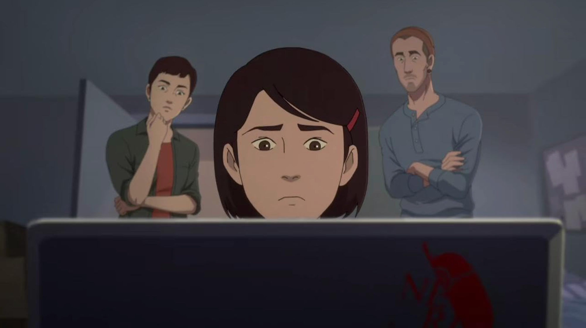 Animated still, showing a girl sitting in front of a computer screen. Two adults stand over each shoulder watching her work. 