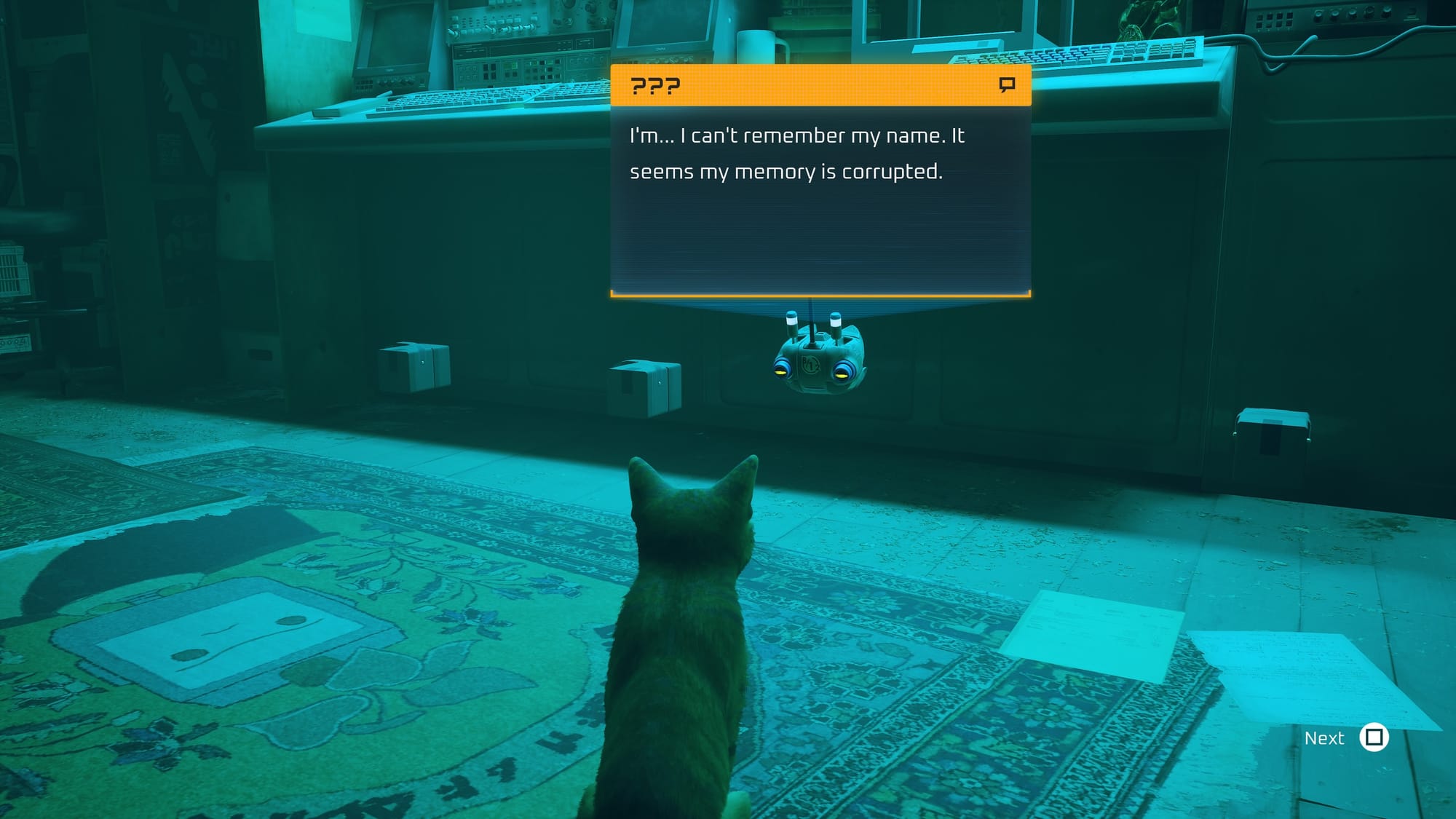An orange cat looks at a small floating robot in a room cull of computers, glowing with blue light. The robot says, "I'm... I can't remember my name. It seems my memory is corrupted."