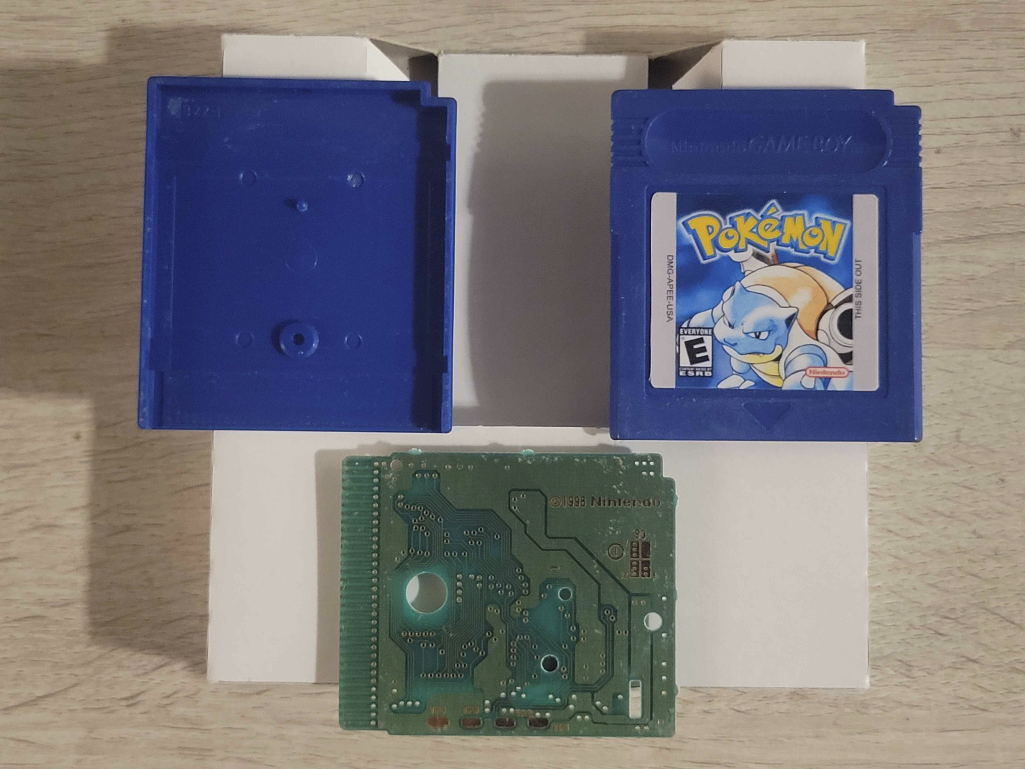 Pokémon Blue shell, cartridge, and cleaned PCB