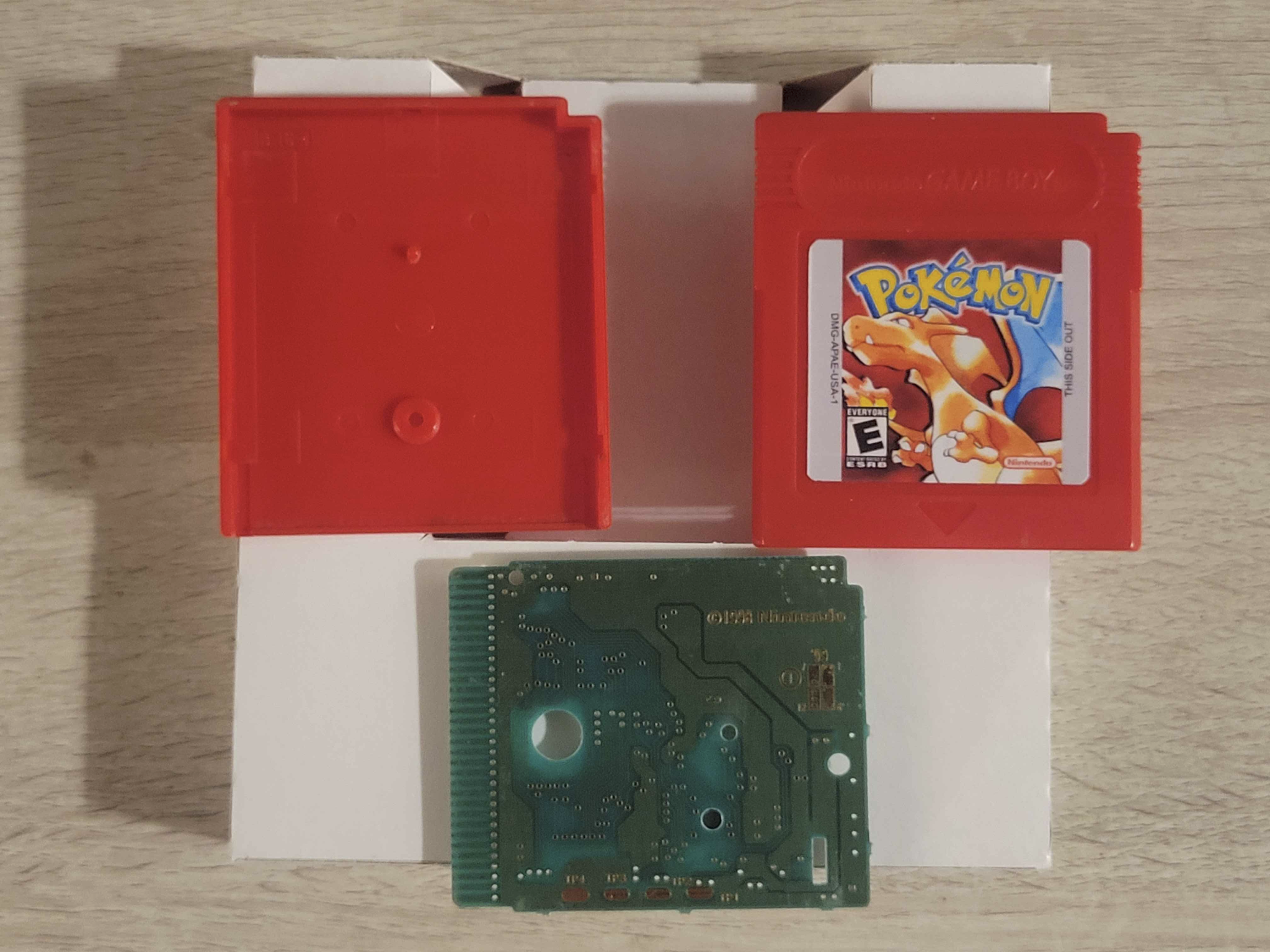 Pokémon Red shell, cartridge, and cleaned PCB
