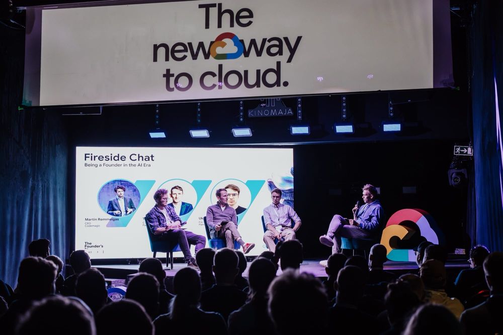 Taivo Pungas in a fireside chat on a Google Cloud stage before a full room