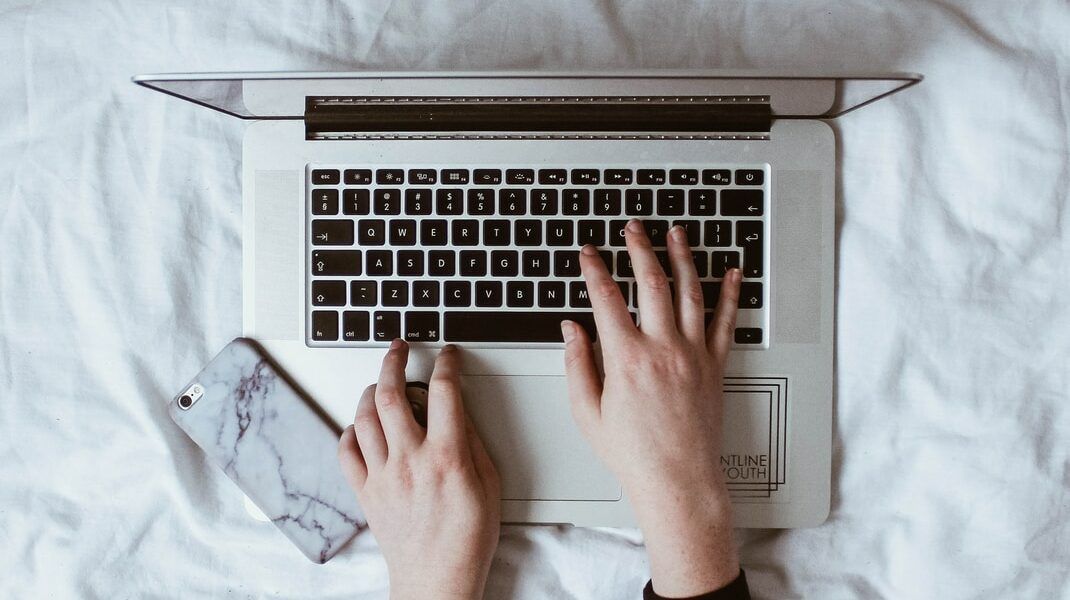 person using laptop computer