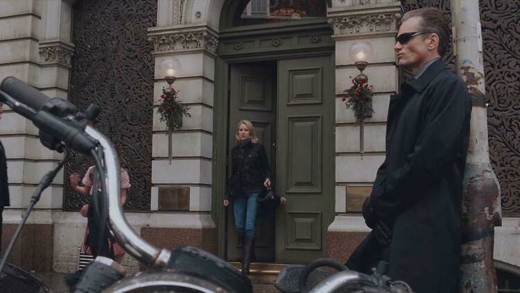 Naomi Watts exits a restaurant to find Viggo Mortensen waiting by her motorcycle in EASTERN PROMISES.