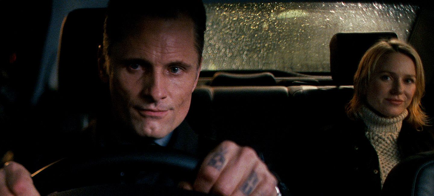 Viggo Mortensen drives Naomi Watts through the streets of London in EASTERN PROMISES.