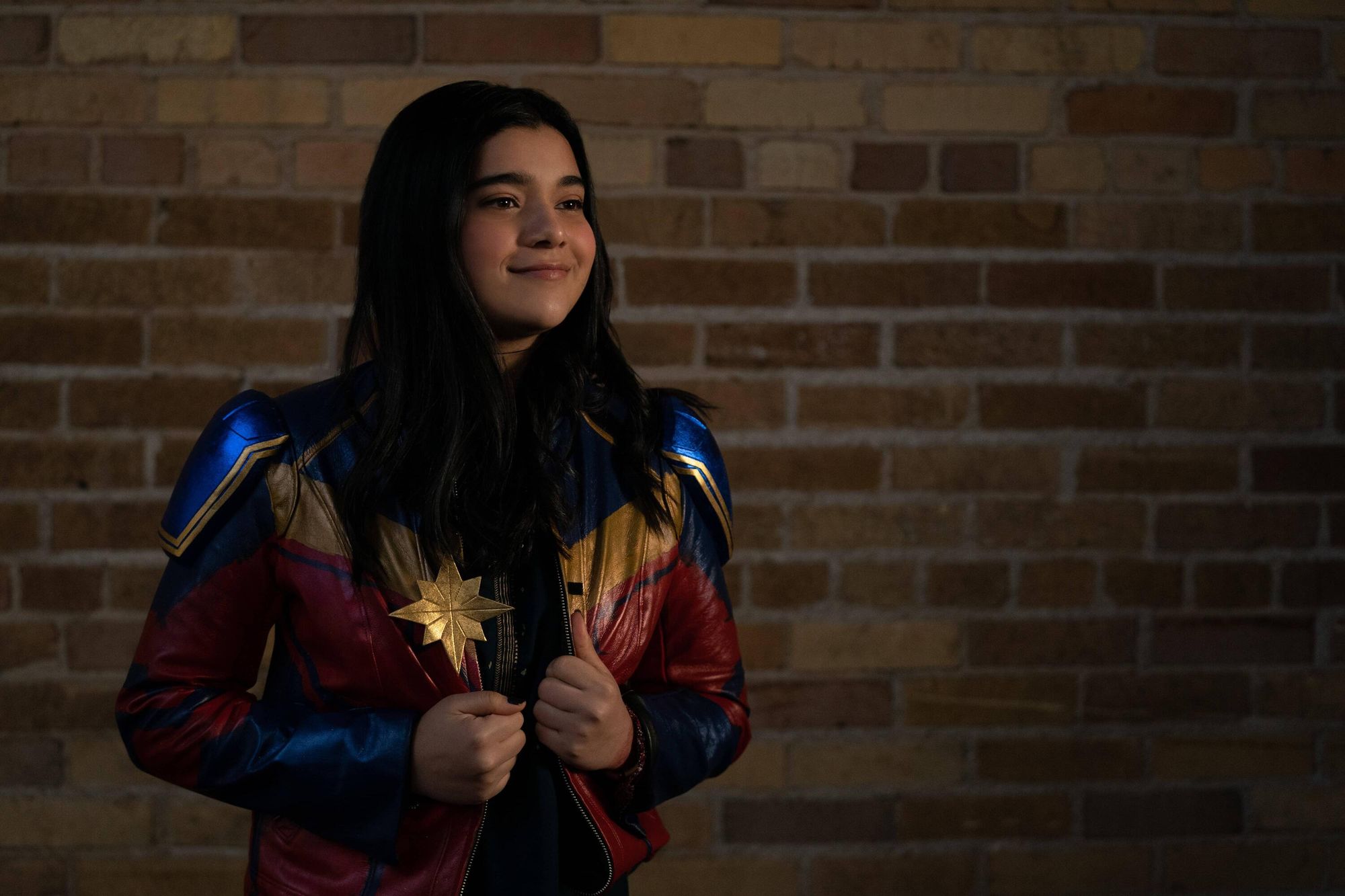 Iman Vellani wears a knockoff version of Captain Marvel's jacket in MS. MARVEL.