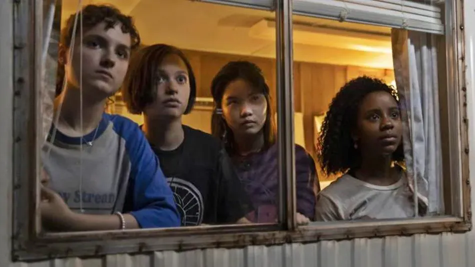 Fina Strazza, Sofia Rosinsky, Riley Lai Nelet and Camryn Jones peer out a window at ... something.