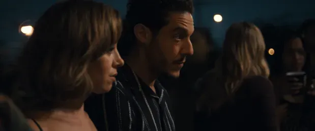 Aubrey Plaza and Theo Rossi enjoy a moment at a house party in EMILY THE CRIMINAL.