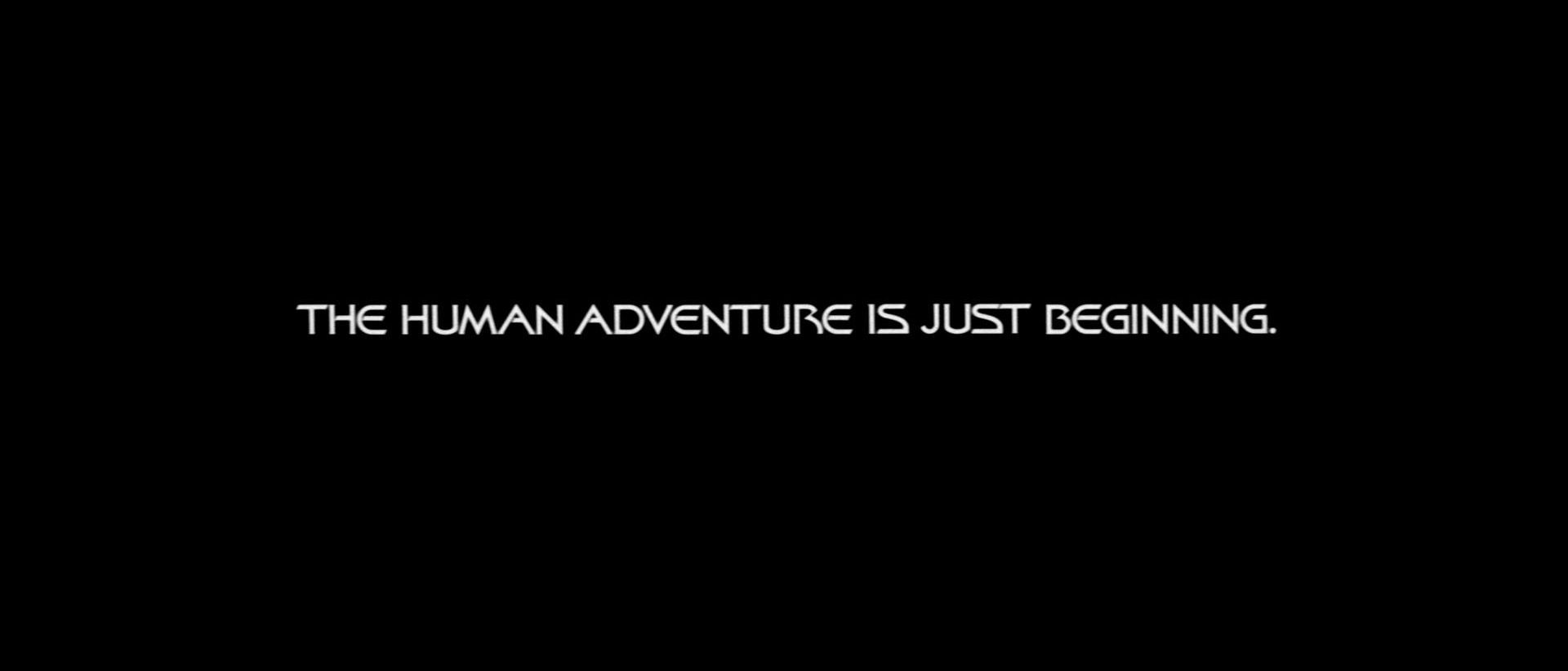 A text screen from ... a certain movie, reading "The Human Adventure Is Just Beginning."