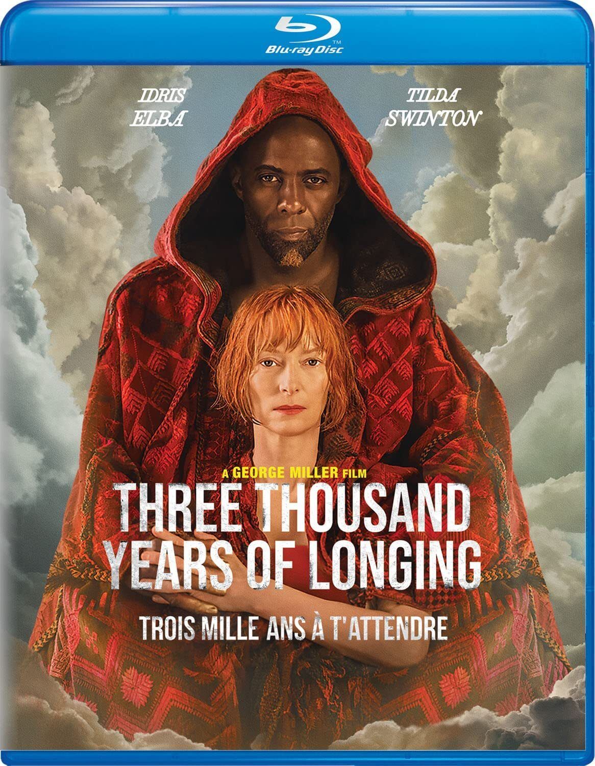 The Blu-ray cover of THREE THOUSAND YEARS OF LONGING depicts a very tall Idris Elba wearing a heavy red cloak, which also contains Tilda Swinton.