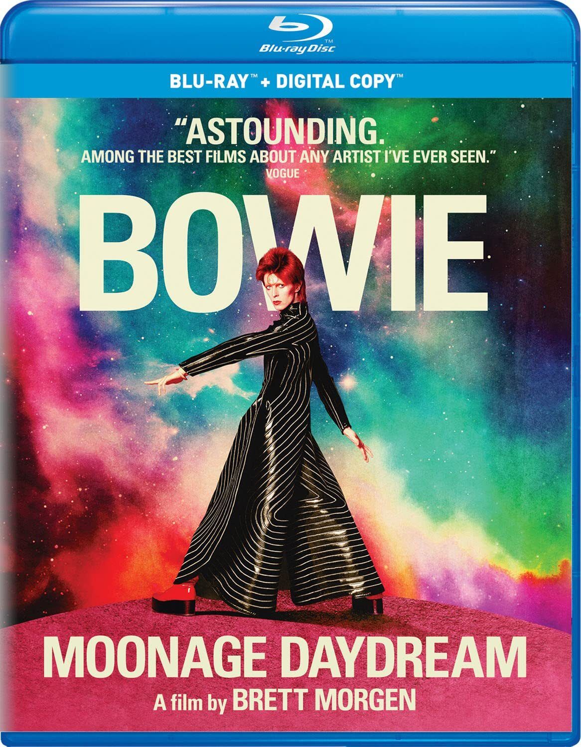 David Bowie strides across a sphere wearing a black-and-white suit-robe thing and red platforms on the cover of the MOONAGE DAYDREAM Blu-ray.
