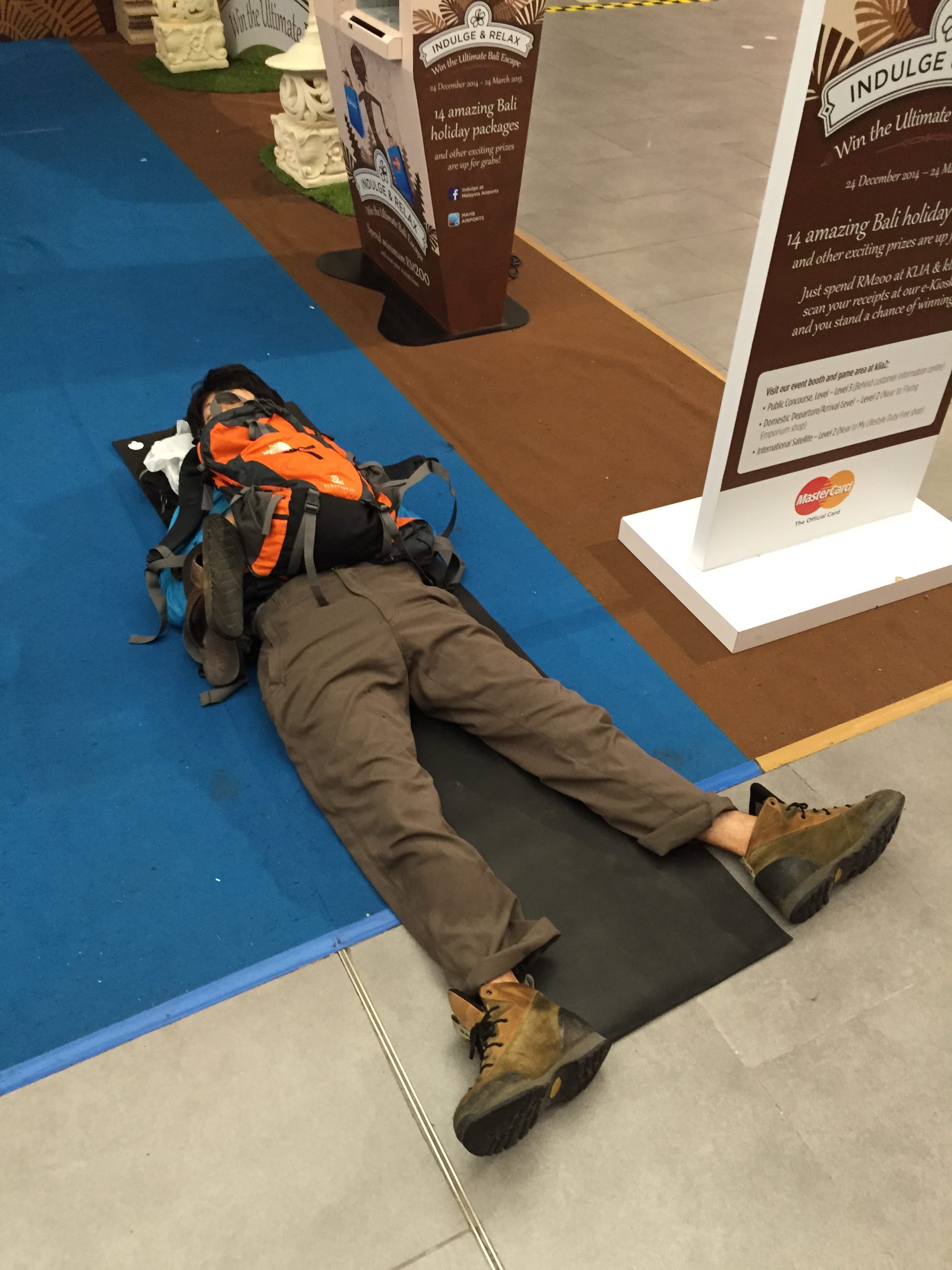 Photo by Author — who got a better night of sleep? Me in the Plaza Premium Lounge at KLIA2, or this guy?
