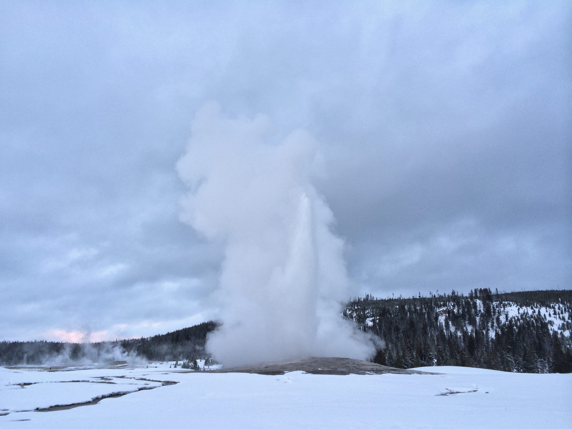 Photo by Author — Old Faithful erupting, Yellowstone National Park