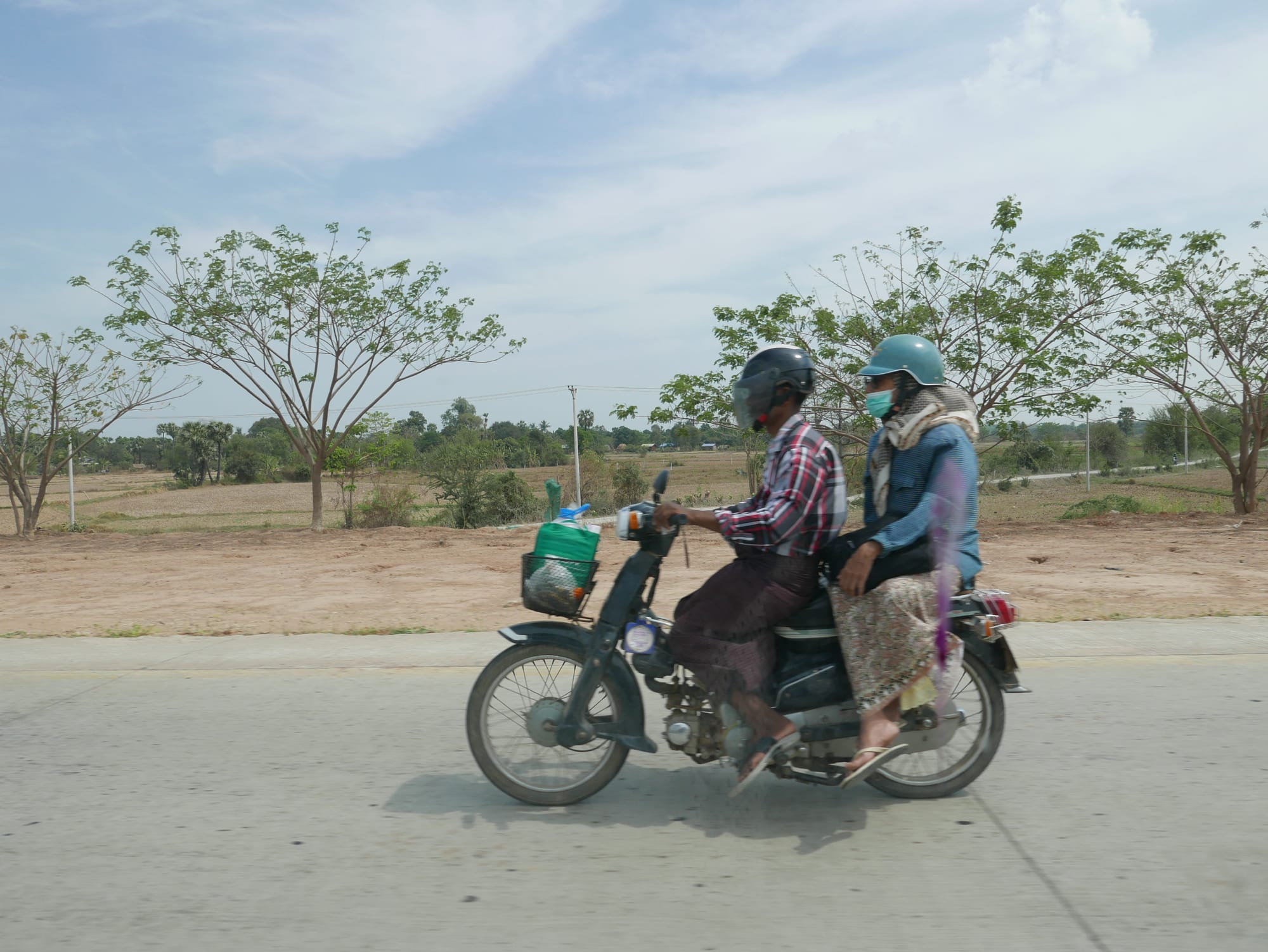 Photo by Author — pillion passenger riding sidesaddle — Myanmar