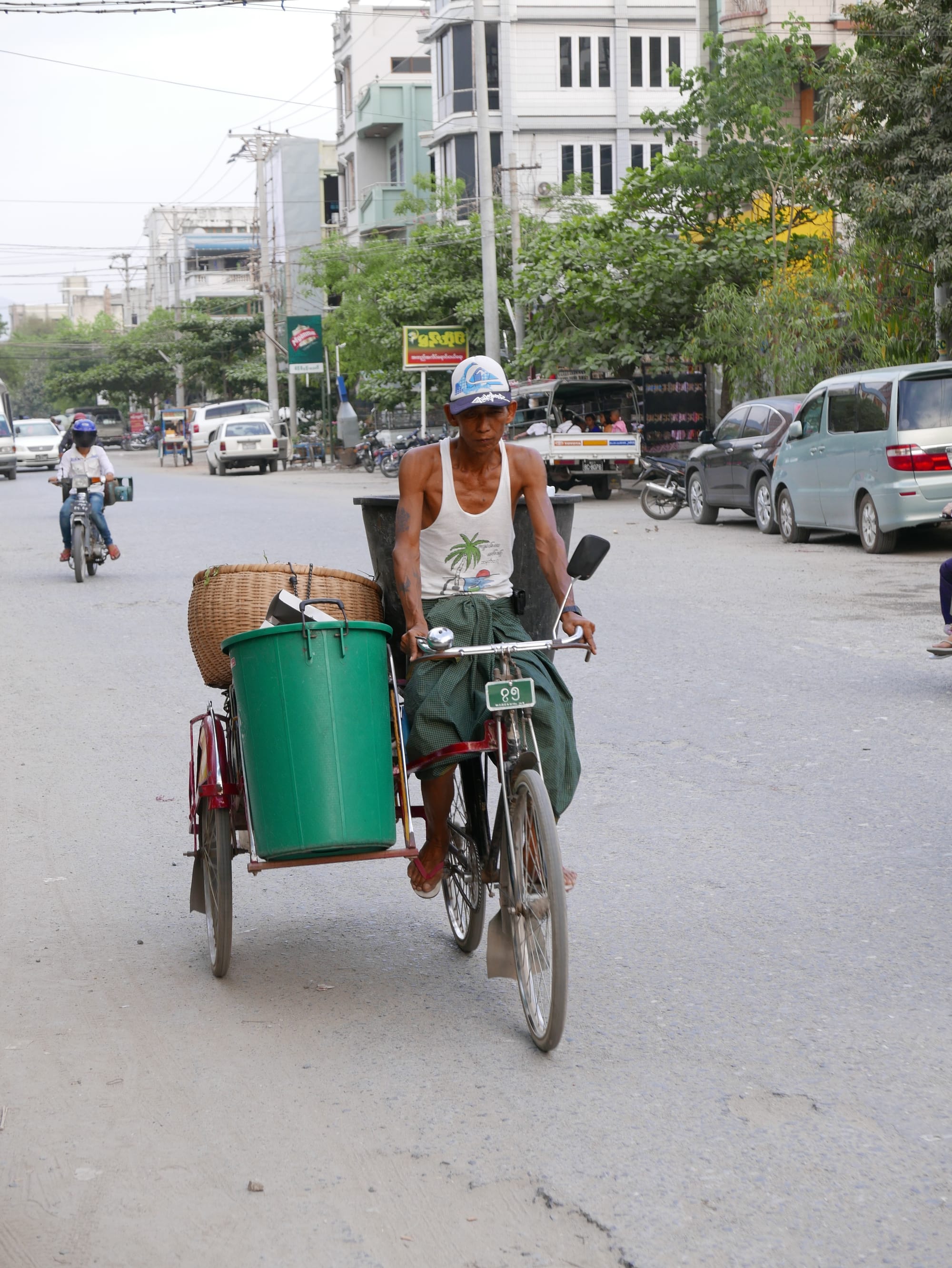 Photo by Author — a local street cleaner on their bike