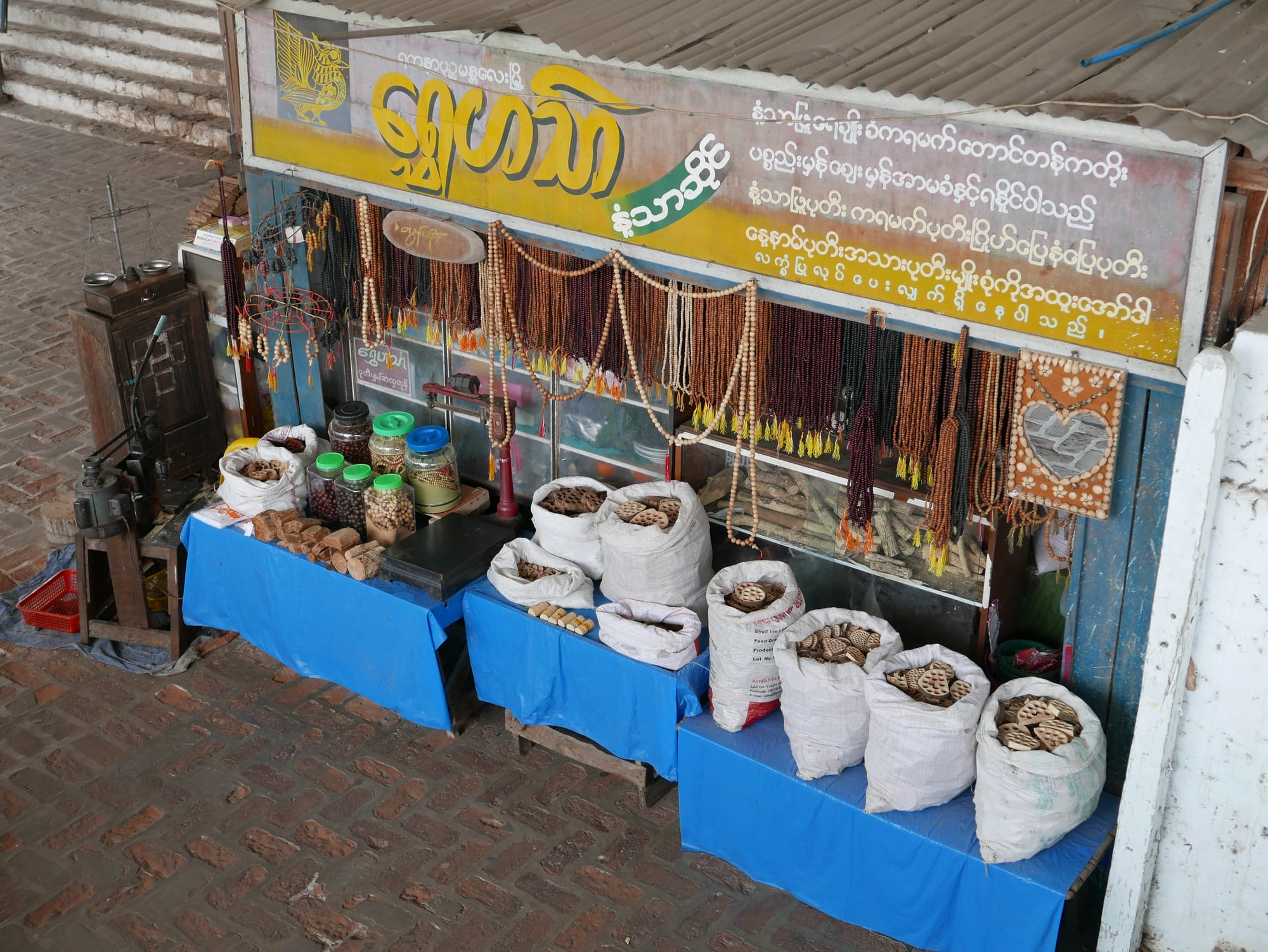 Photo by Author — a bead seller on Mandalay Hill