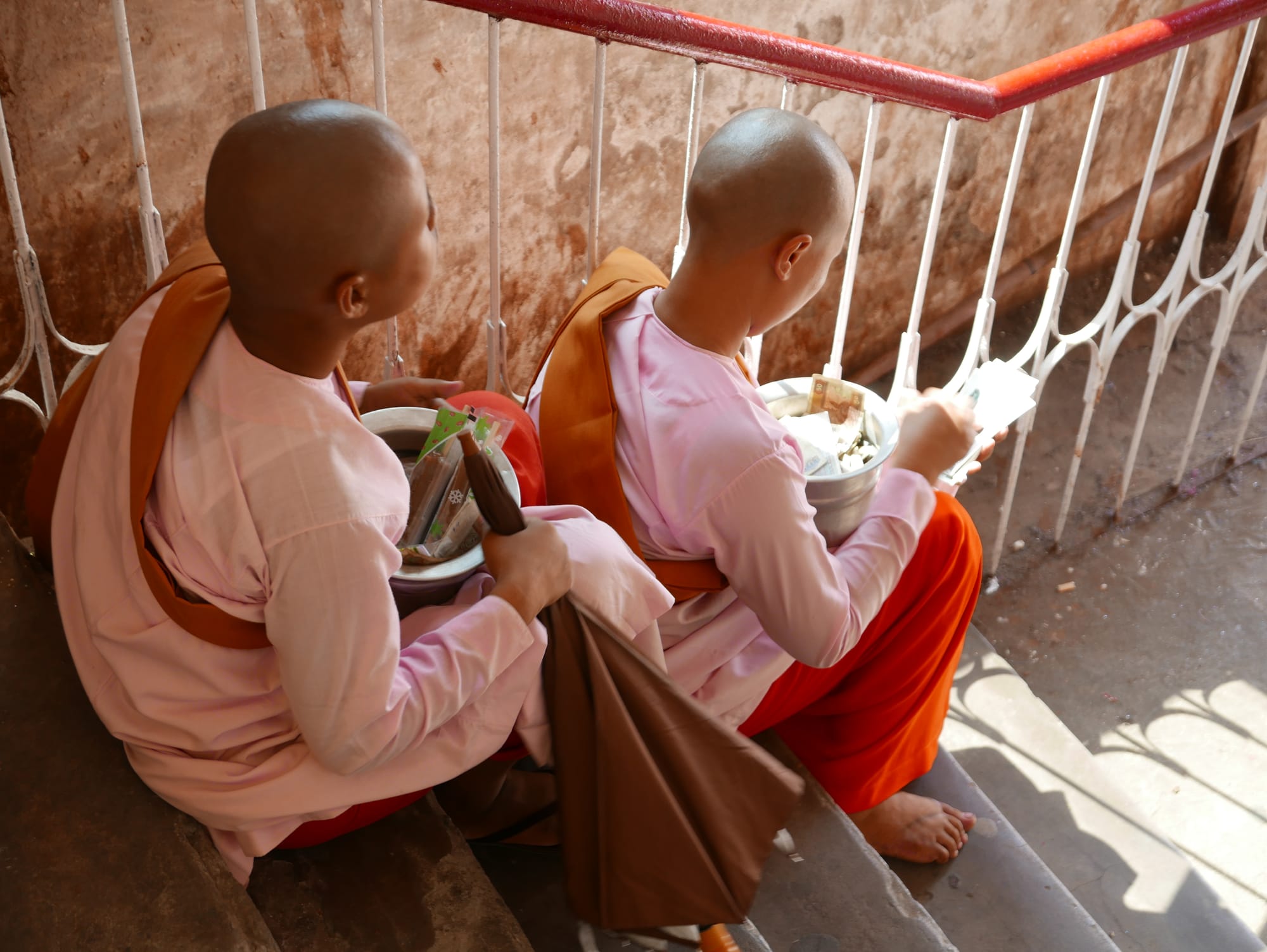 Photo by Author — “pink nuns” counting their donations