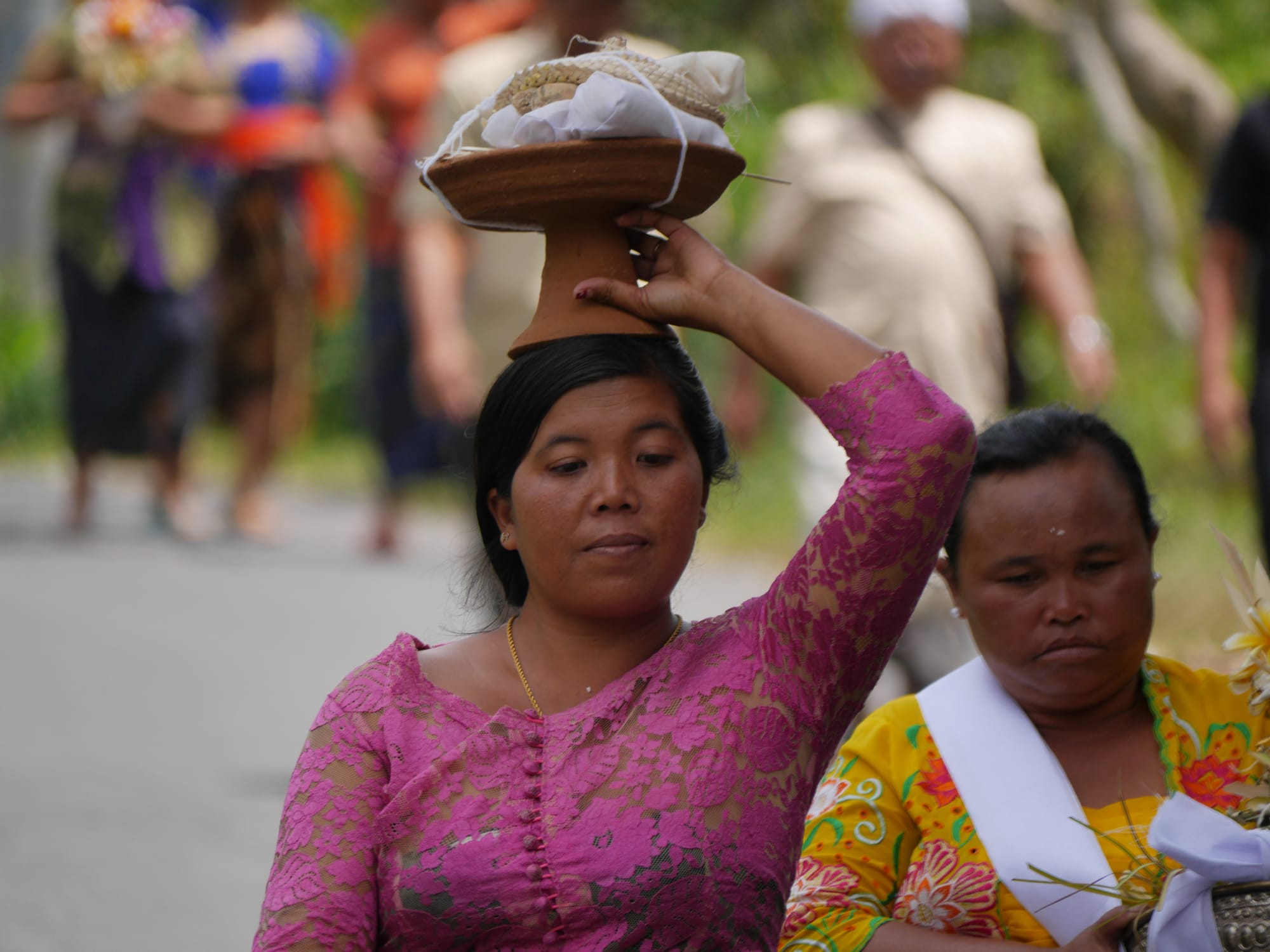 Photo by Author — a mourner at a cremation procession in Bali