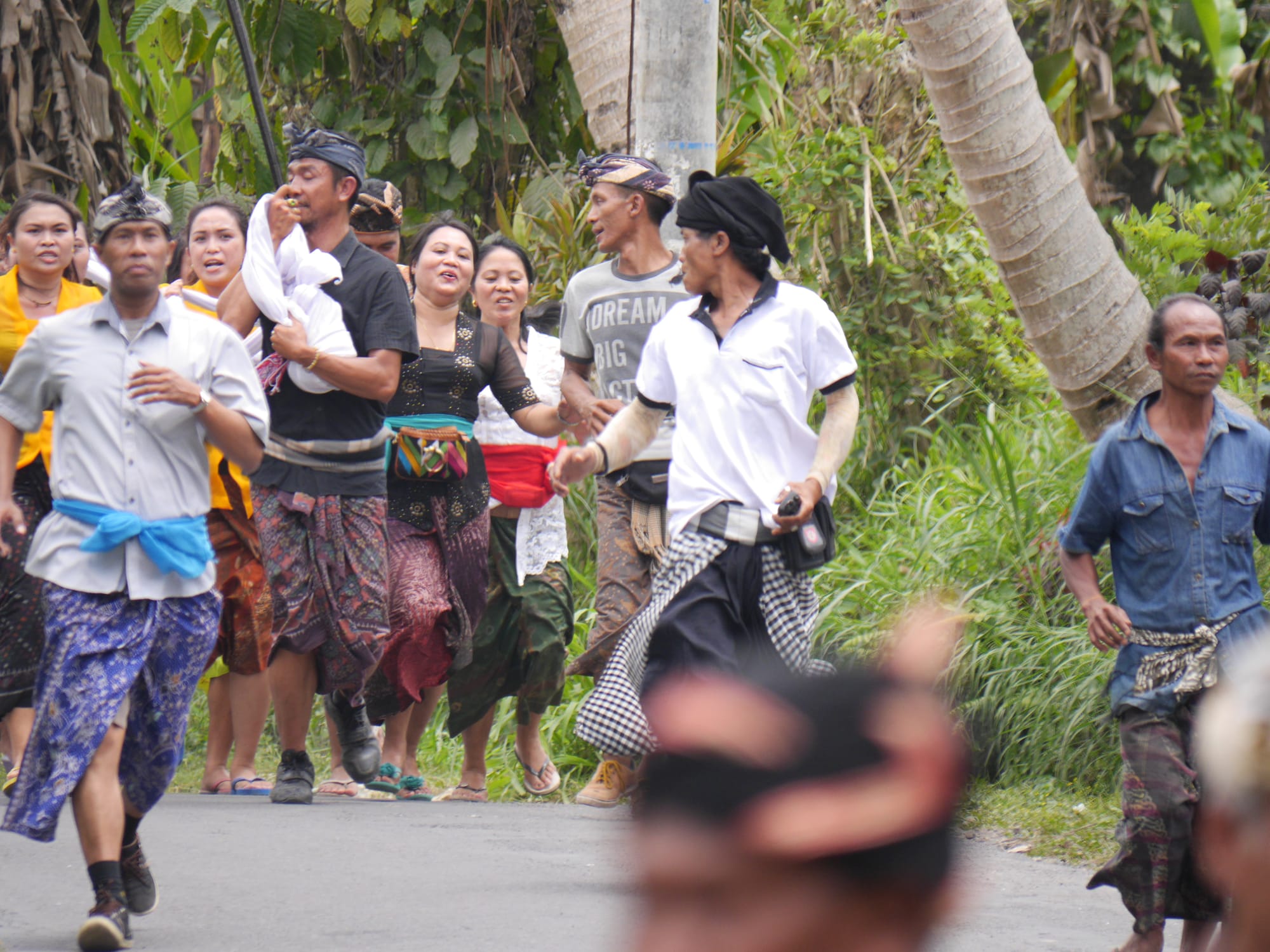 Photo by Author — mourners at a cremation procession in Bali