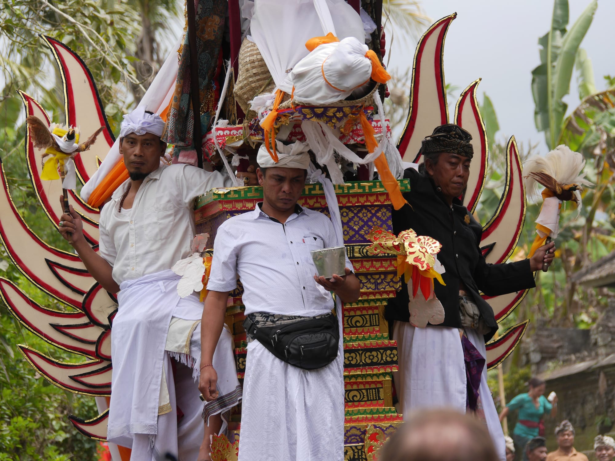 Photo by Author — mourners at a cremation procession in Bali