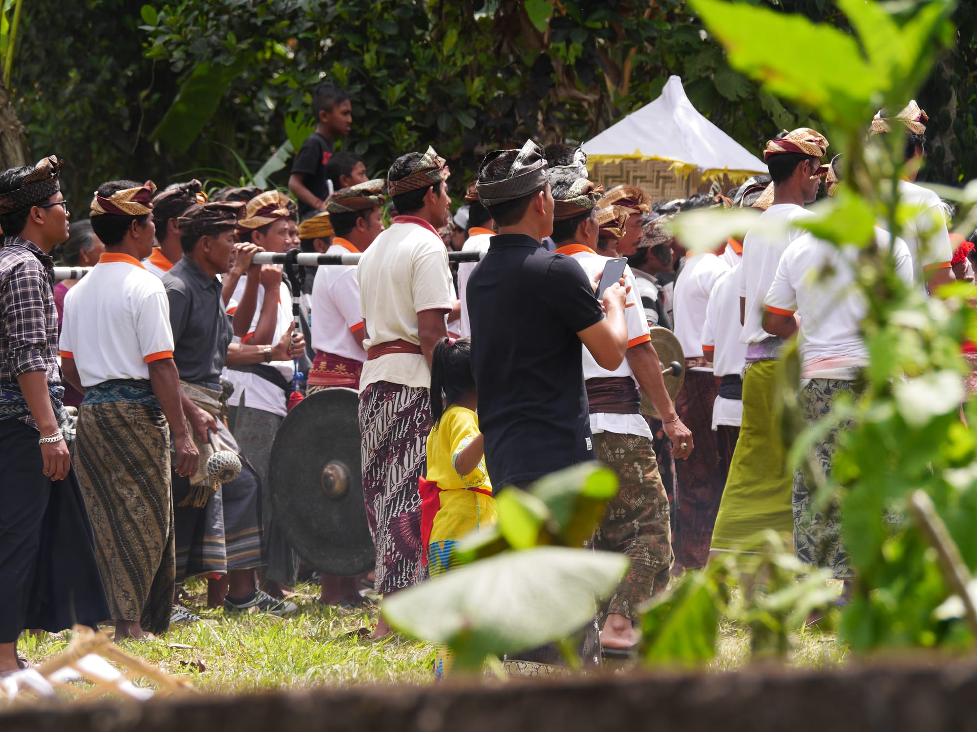 Photo by Author — mourners at a cremation procession in Bali