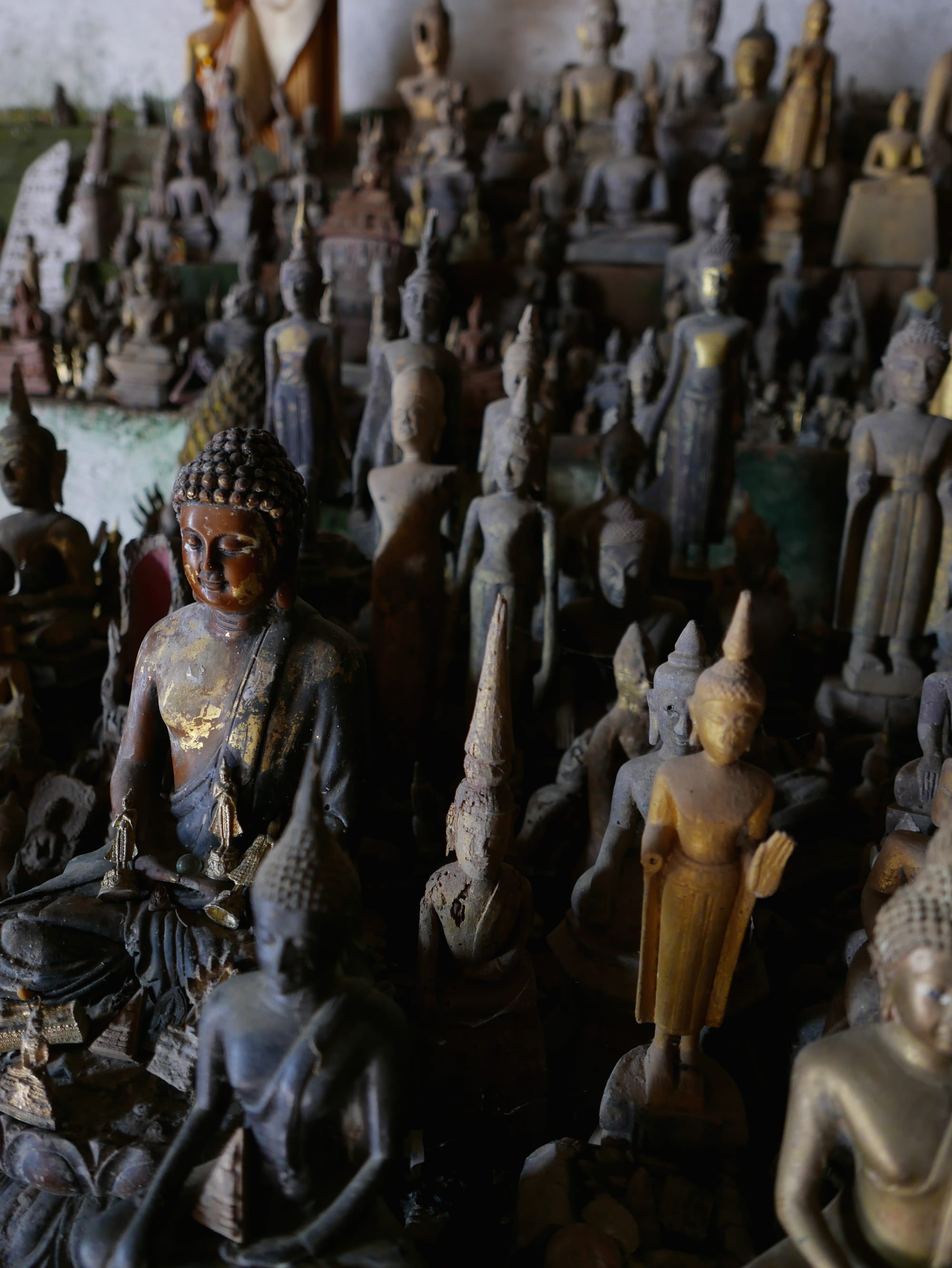 Photo by Author — Buddhas in the Tham Ting (Tam Ting)/Pak Ou (ถ้ำติ่ง) Caves, Laos
