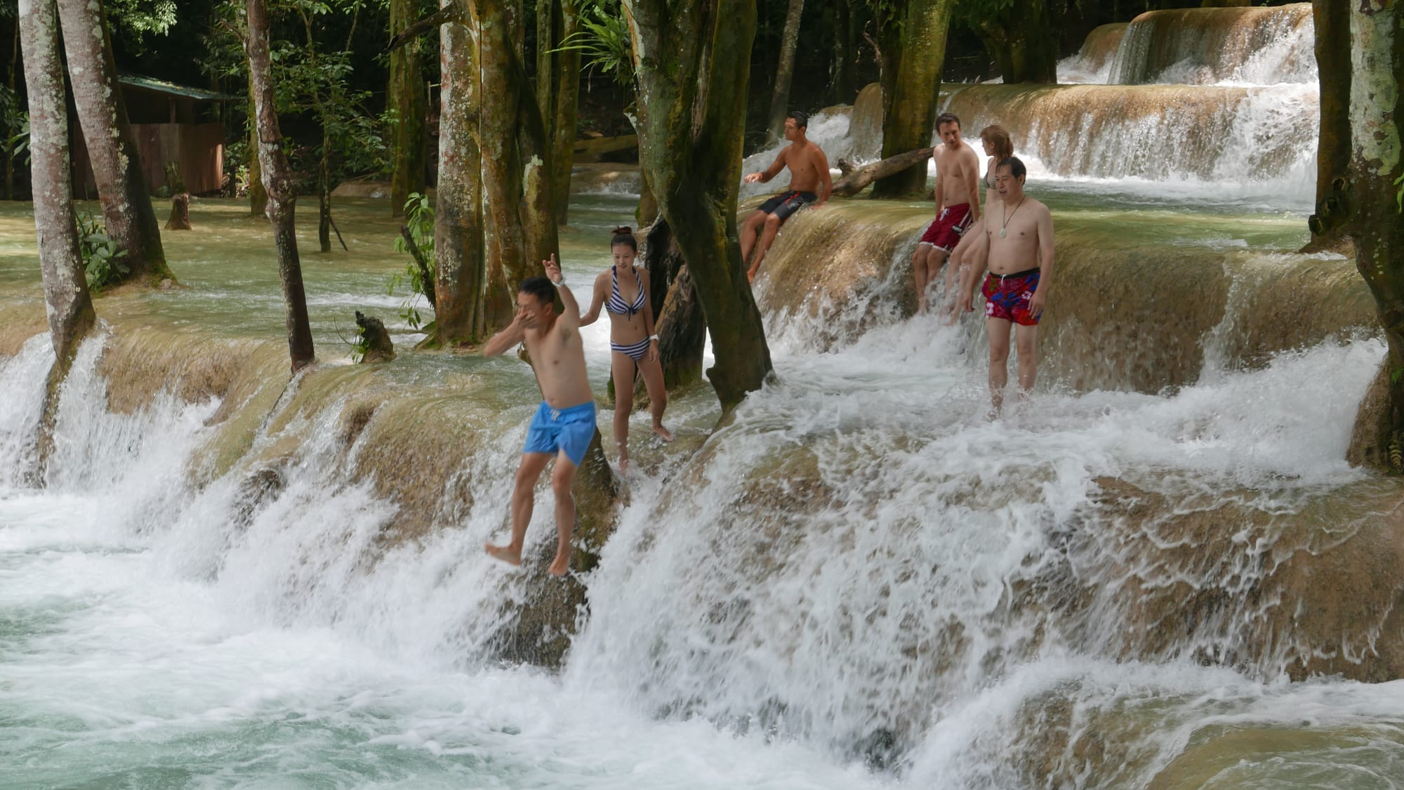 Photo by Author — a photo burst of jumping the falls — Tad Sae Waterfalls (ຕາດແສ້), Luang Prabang (ຫລວງພະບາງ/ຫຼວງພະບາງ), Laos