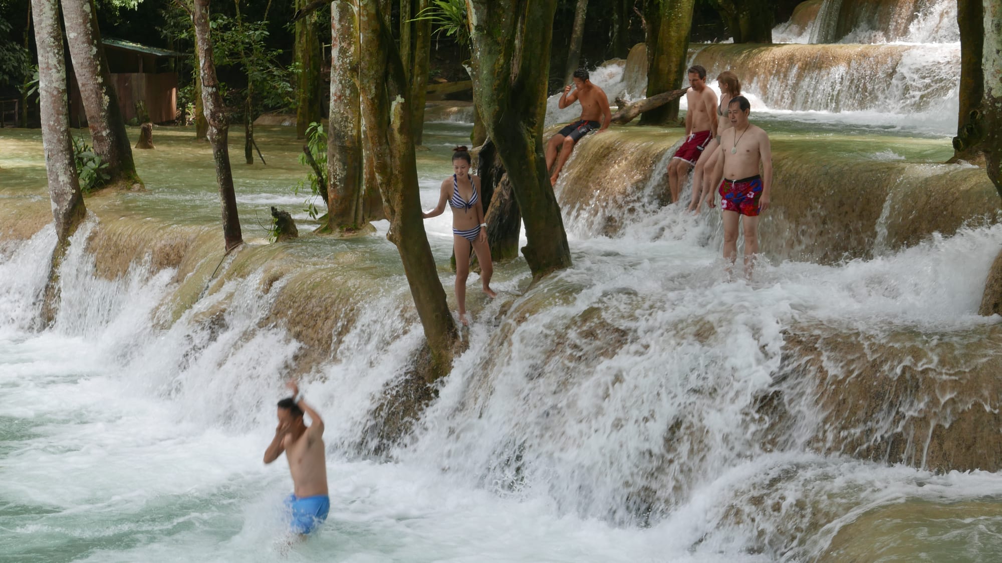 Photo by Author — a photo burst of jumping the falls — Tad Sae Waterfalls (ຕາດແສ້), Luang Prabang (ຫລວງພະບາງ/ຫຼວງພະບາງ), Laos