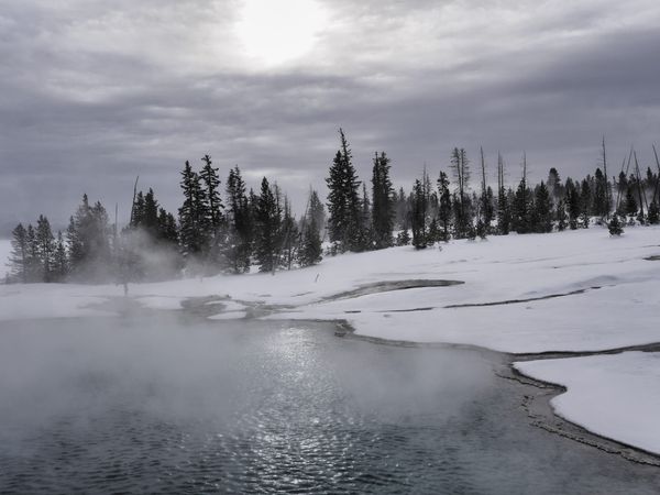 Yellowstone - down by a lake with team rising and snow on the ground
