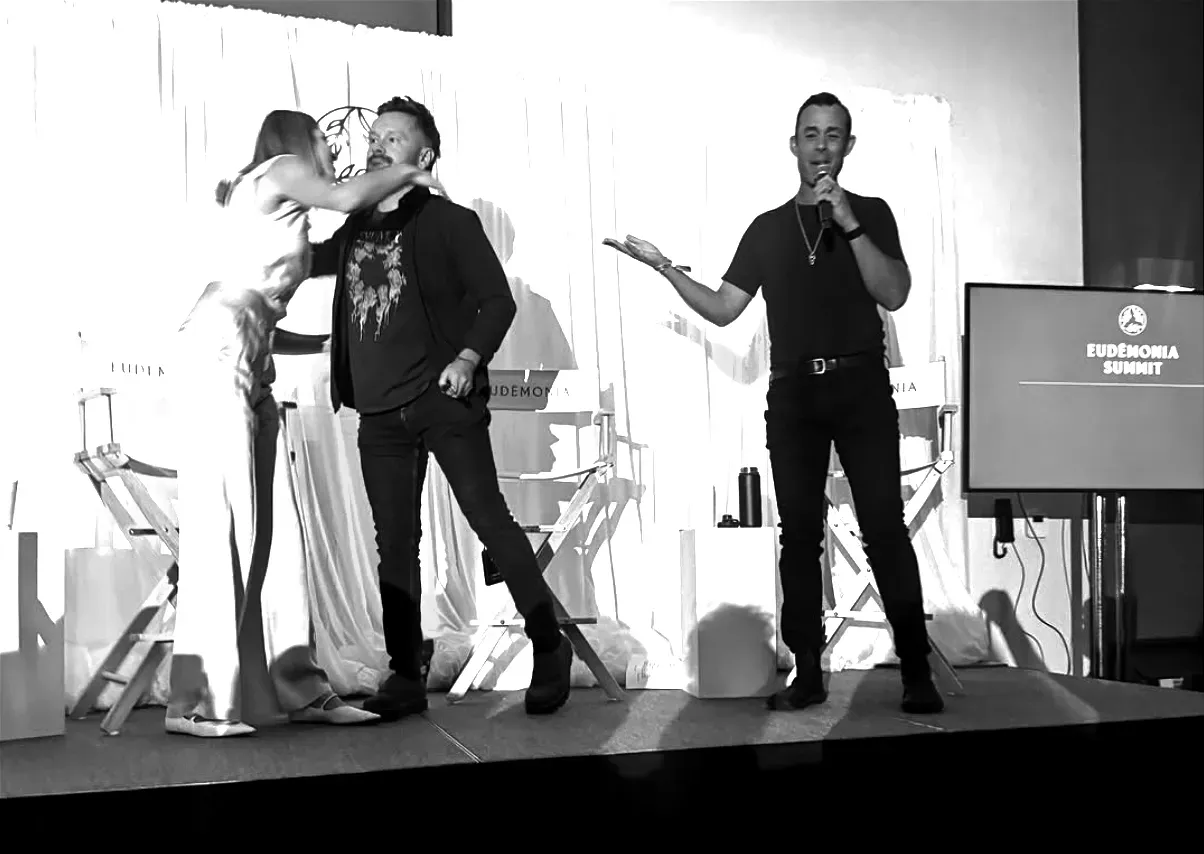 Dr. Will Cole and Dr. Jessica Knurick hug after participating in the author's panel discussion | Photo from Jeff Krasno