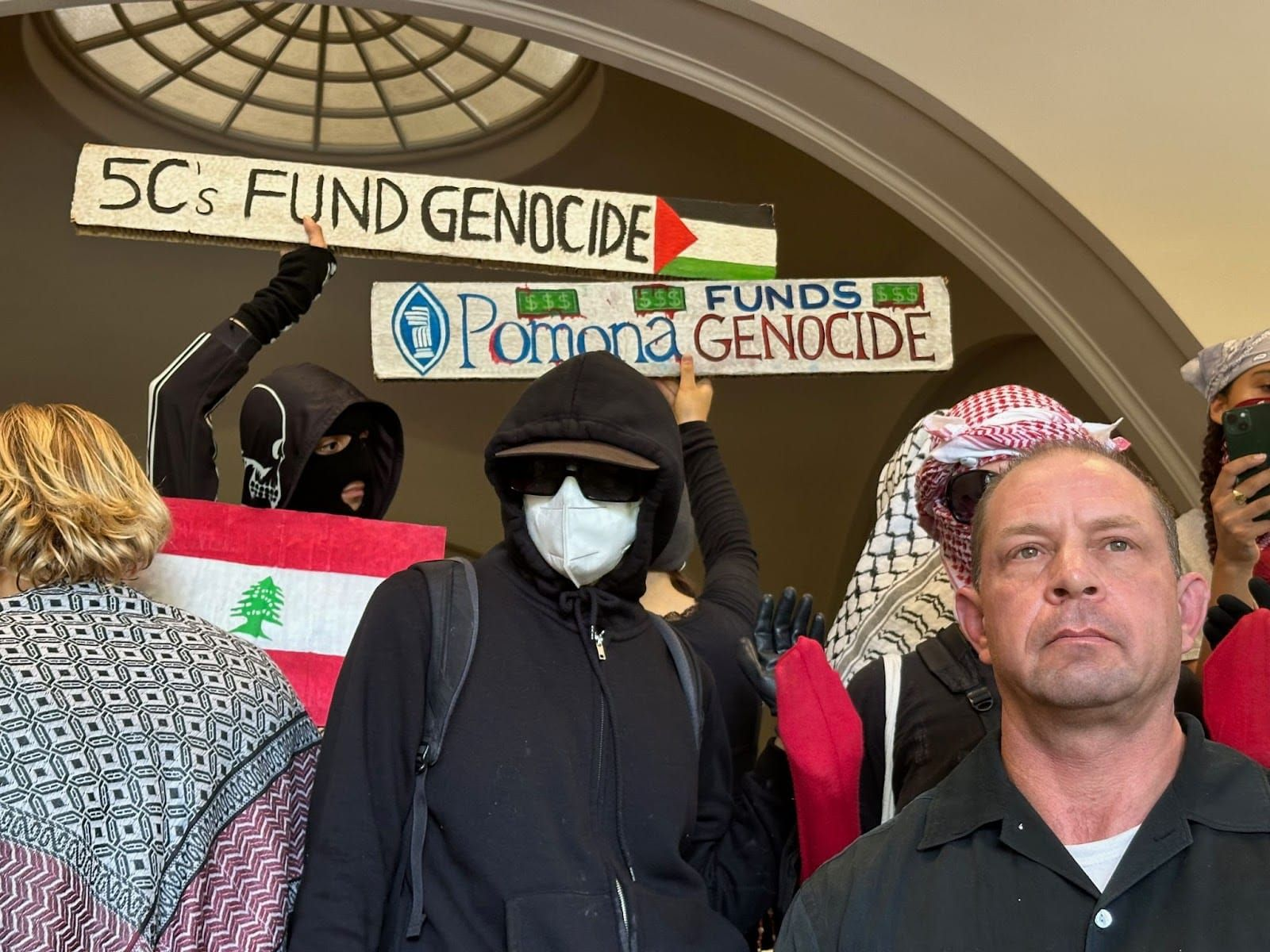 Protesters obstruct staircase, denying professor access to his office | Photo from Kendall White