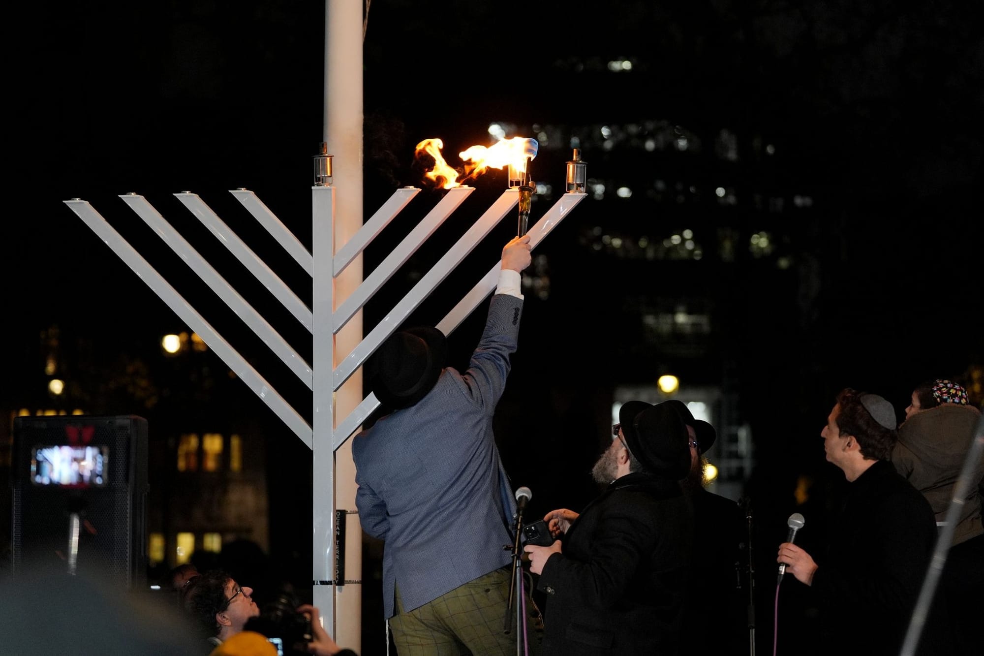Rabbi Shimshon Gansbourg menorah in London, England, at an event commemorating the shooting in Bondi Beach in Sydney, Australia — December 15, 2025 | PA via Reuters