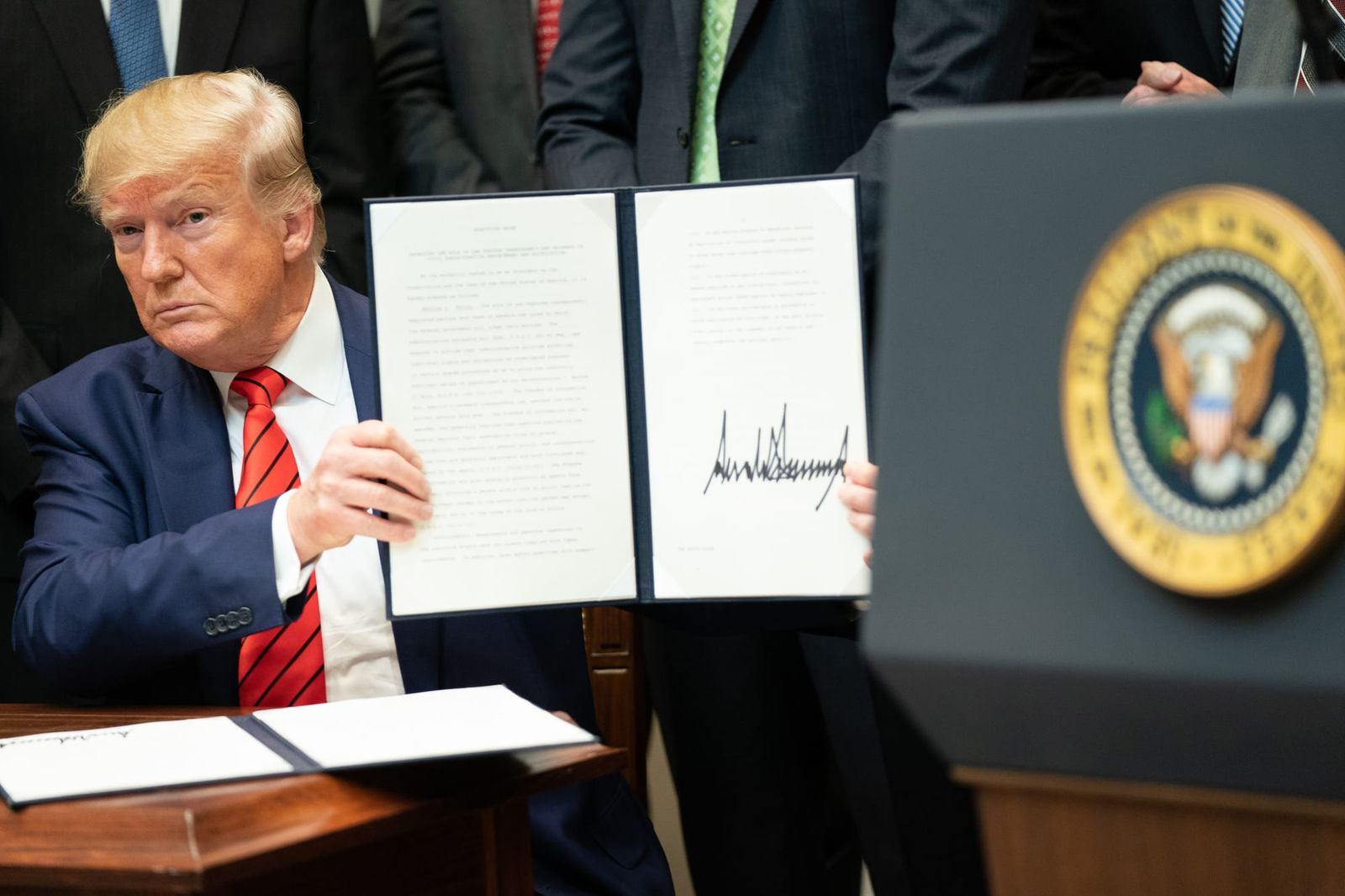 Trump signing an executive order in 2019. | Official White House Photo by Shealah Craighead