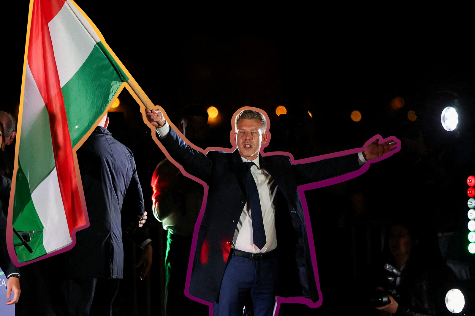 Opposition party leader Peter Magyar waves a Hungarian flag in celebration after incumbent Prime Minister Viktor Orbán conceded defeat in the country's election. 