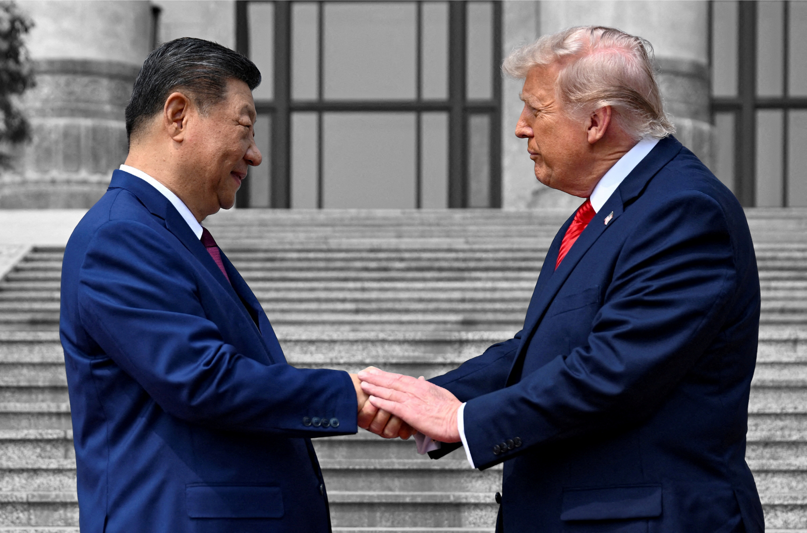 President Donald Trump greets Chinese President Xi Jinping in Beijing — May 14, 2026 | Kenny Holston/Pool via REUTERS/File Photo, edited by Russell Nystrom